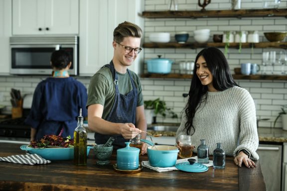 People cooking together at a corporate kitchen event 